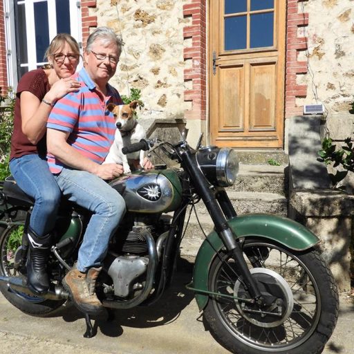 Claire and Stephen sitting on a BSA motorbike