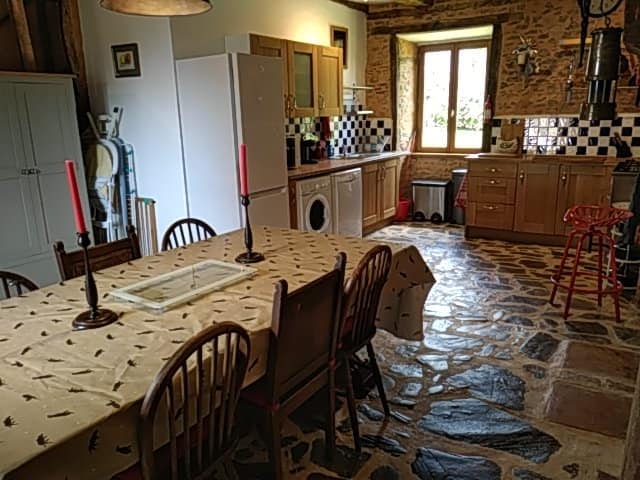 View of the large kitchen with gorgeous stone floor