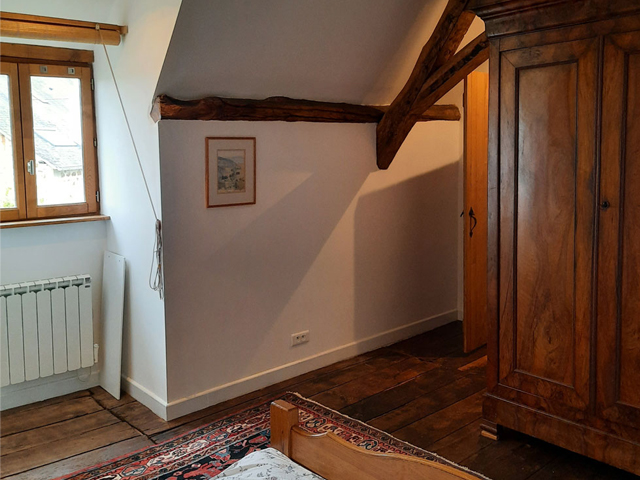 The master bedroom with a beautiful walnut wardrobe.